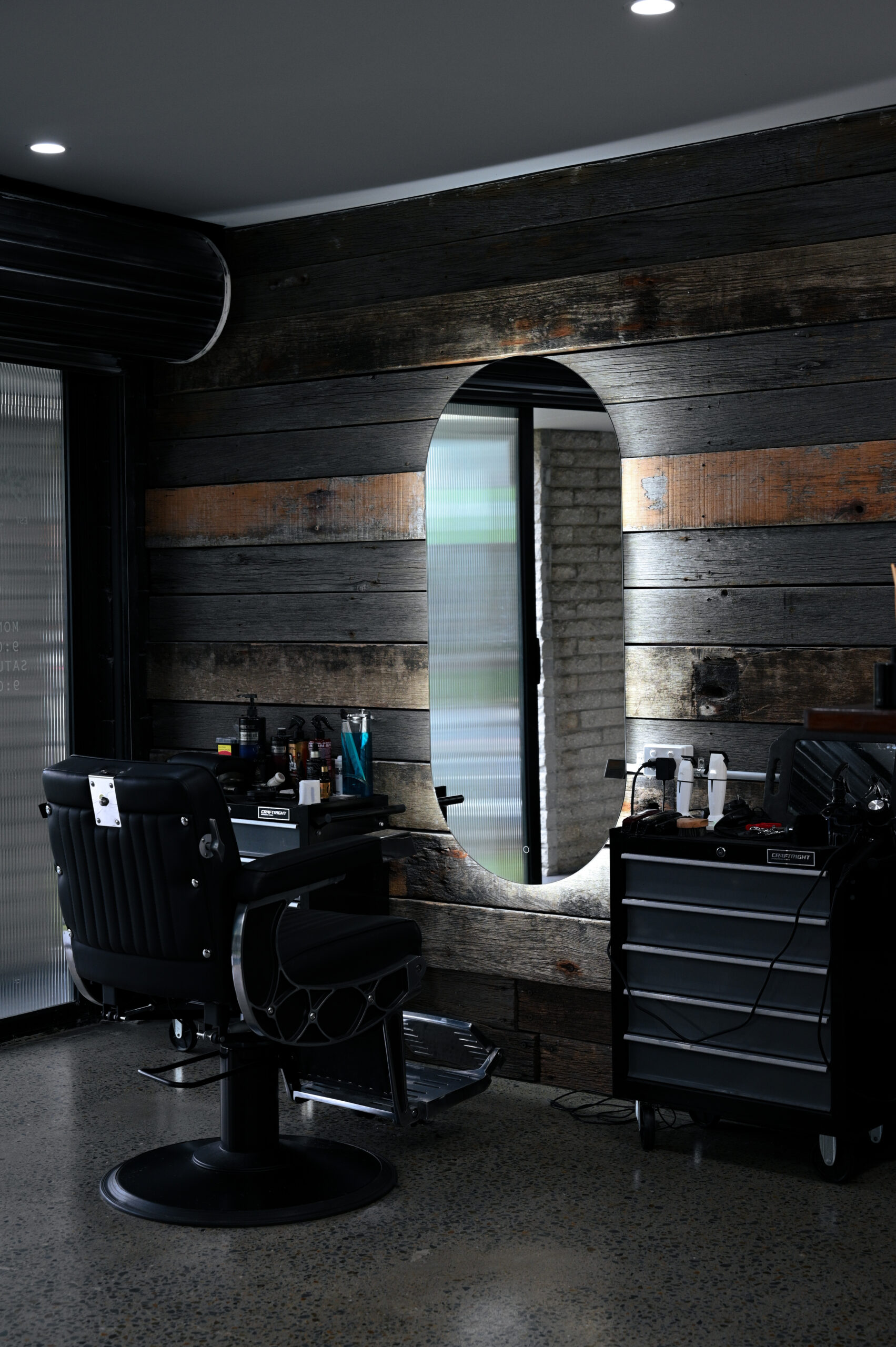 Barber chair against reclaimed timber